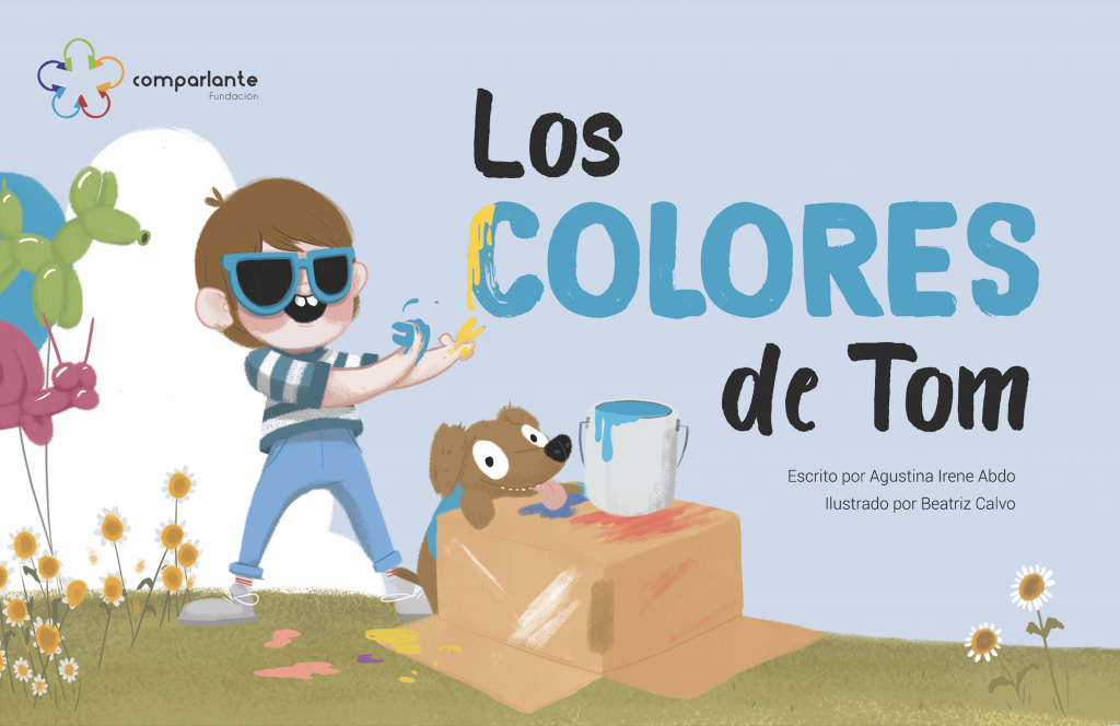 Portada del cuento “Los Colores de Tom” historia ganadora del Primer Premio en el Concurso Literario Internacional “Mi Mundo A Mi Manera primera edición”. Aparece el personaje central con sus manos llenas de pintura, su perro guía y unas flores. Además del nombre de la obra, aparecen los nombres del escritor, la ilustradora y el logo de Fundación Comparlante.