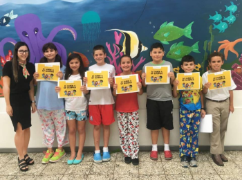 David Jiménez Caamaño winner of the Third Prize at the International Literary Contest "My World My Way" poses with his classmates, all of whom hold in their hands a diploma of participation in the Contest.